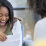 girl-reading-college-acceptance-letter