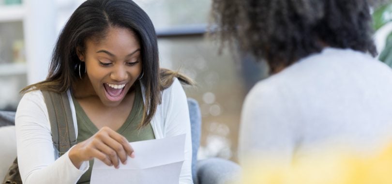 girl-reading-college-acceptance-letter