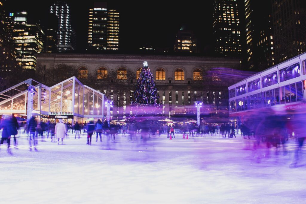 People ice skating at Rockefeller Center in winter.