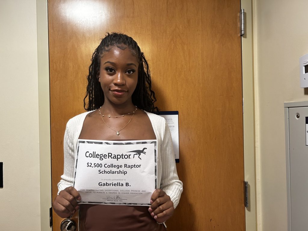 College Raptor Scholarship Winner Gabriella B hold winner's certificate.
